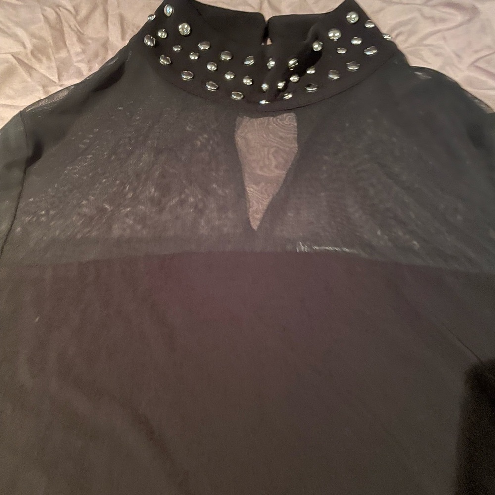 Black studded turtle neck with sheer chest